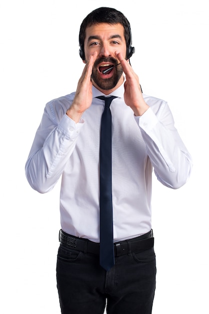 Young man with a headset shouting