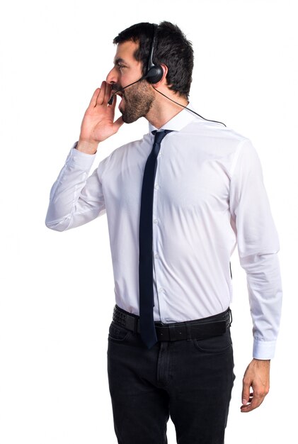 Young man with a headset shouting