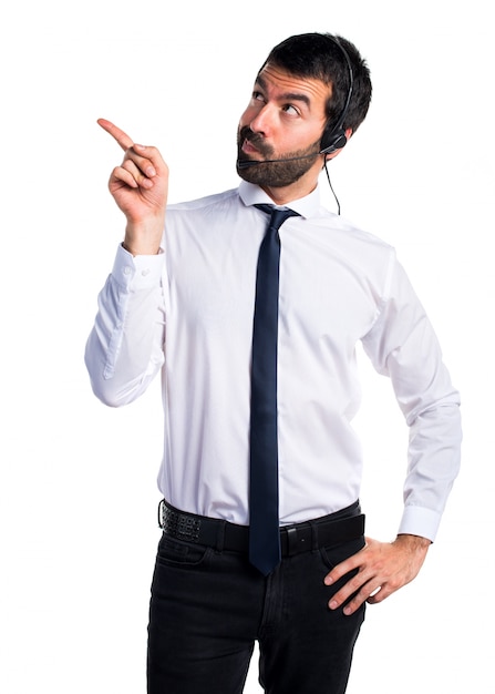 Young man with a headset thinking