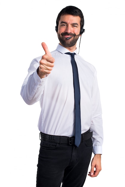 Young man with a headset with thumb up