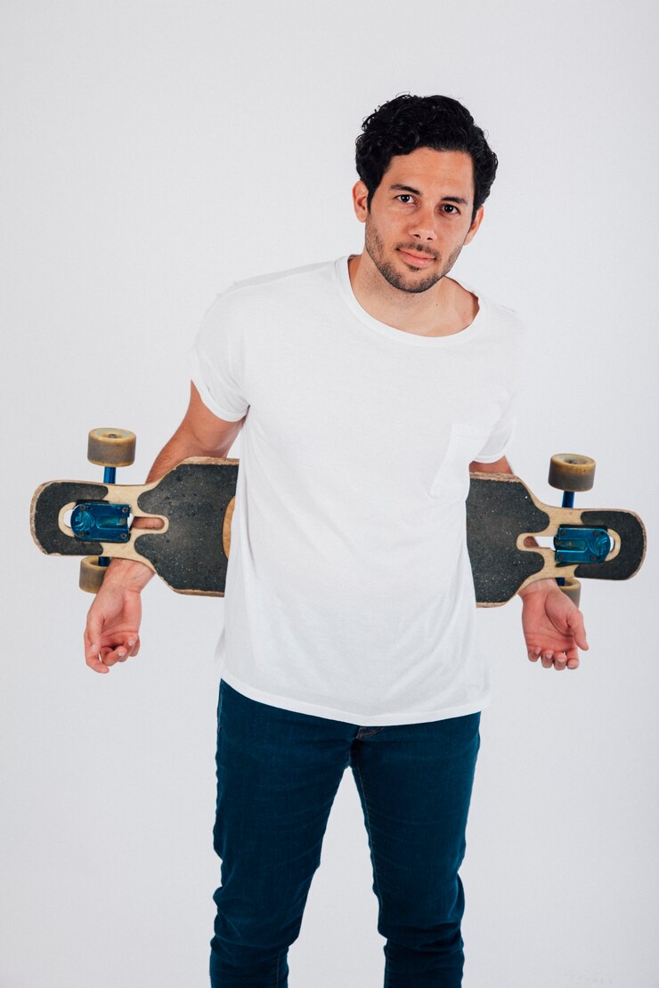 Free Photo young man with longboard behind his back