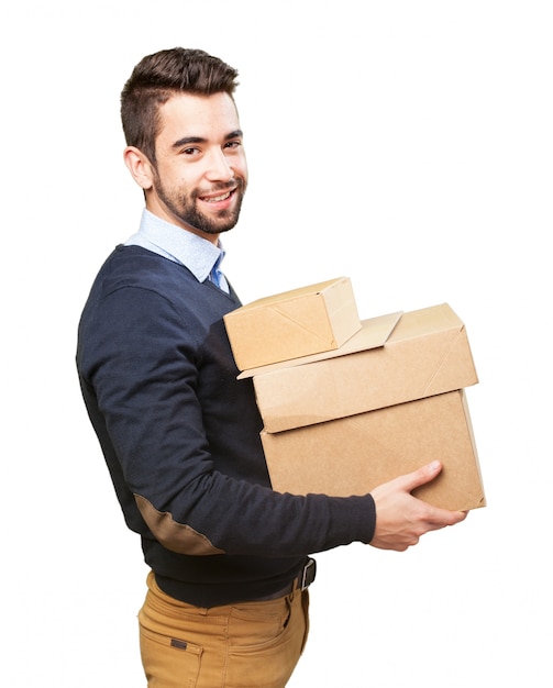 Free photo young man with a lot of boxes