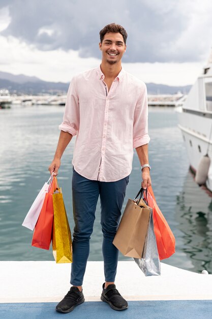 Young man with ocean in the back