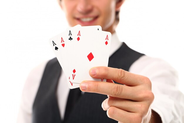 Young man with poker cards