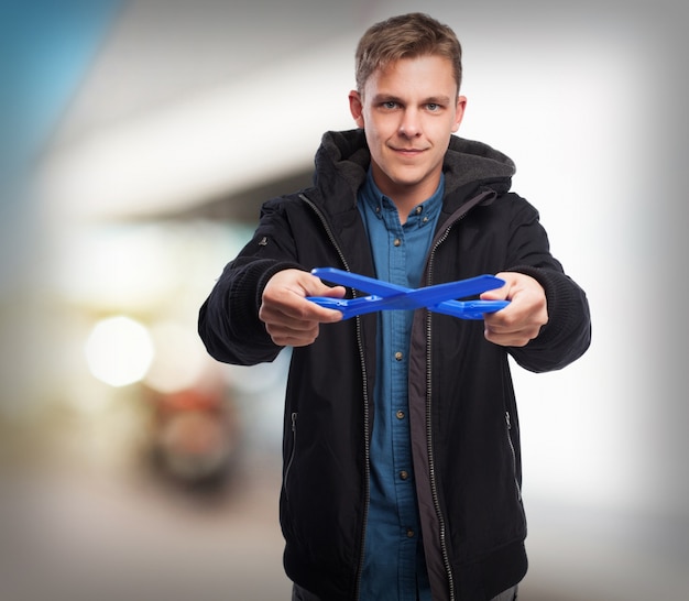 Free photo young man with scissors