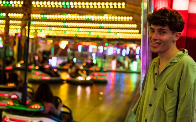 Young man with tongue out on night out