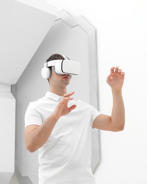 Young man with virtual reality simulator