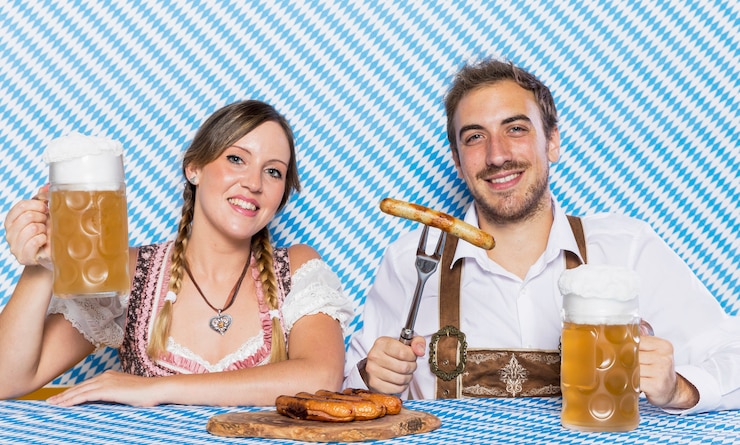 Free Photo young man and woman celebrating oktoberfest