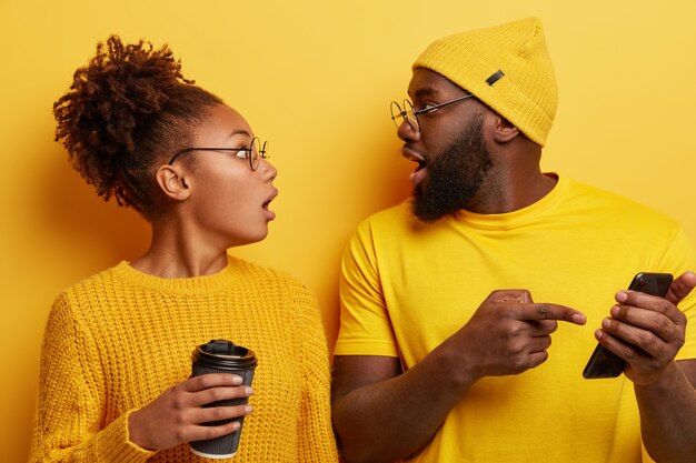 Young man and woman dressed in yellow