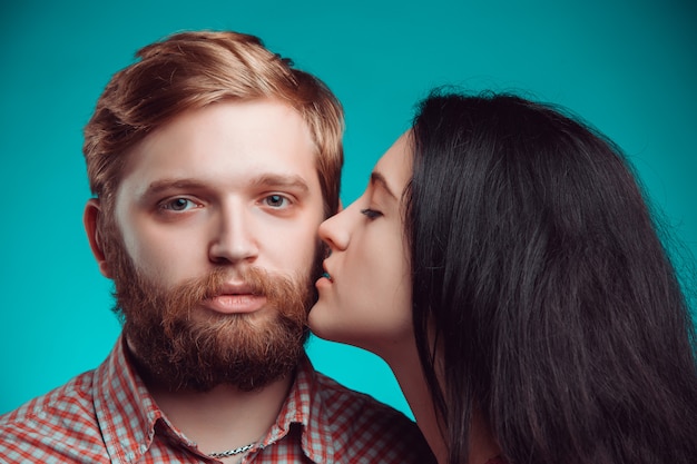 Young man and woman kissing