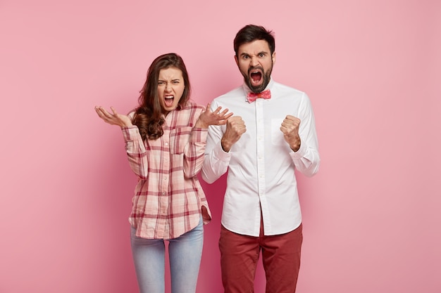 Young man and woman posing together