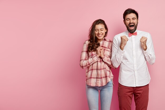 Young man and woman posing together