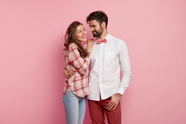 Young man and woman posing together