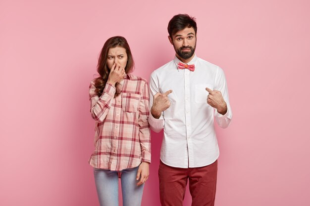 Young man and woman posing together