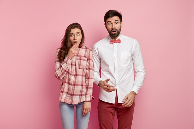 Young man and woman posing together