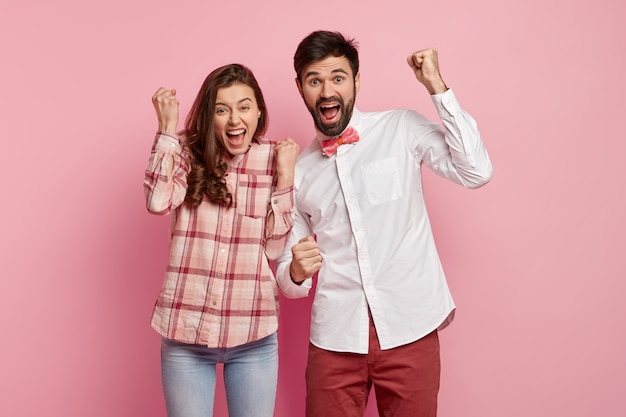 Young man and woman posing together