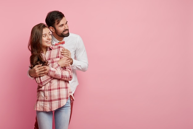 Young man and woman posing together