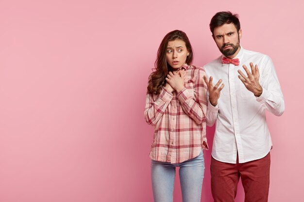 Young man and woman posing together