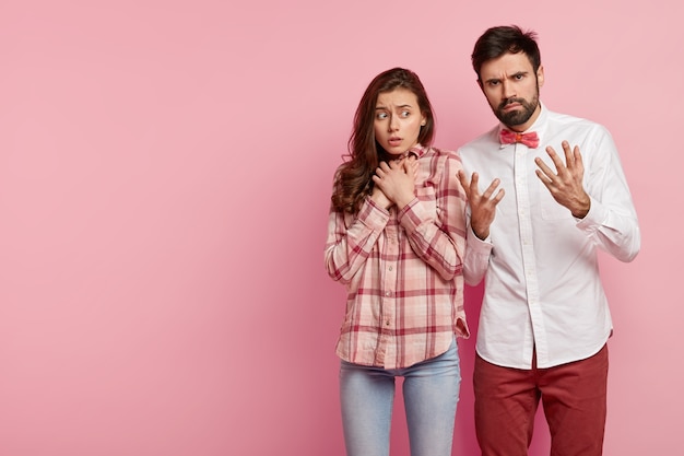 Young man and woman posing together