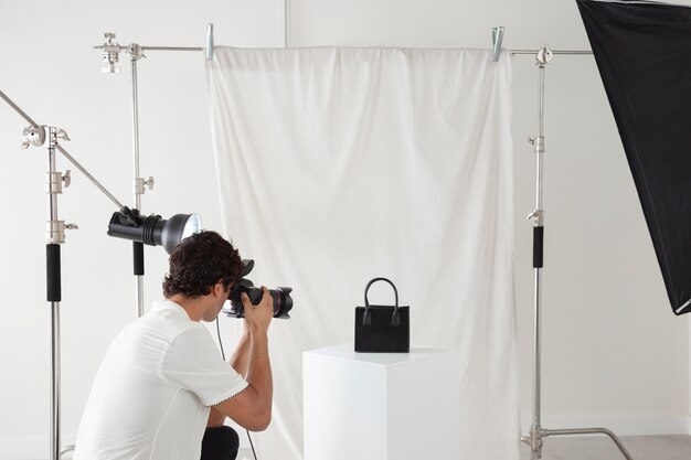 Young man working in his photography studio