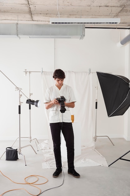 Young man working in his photography studio