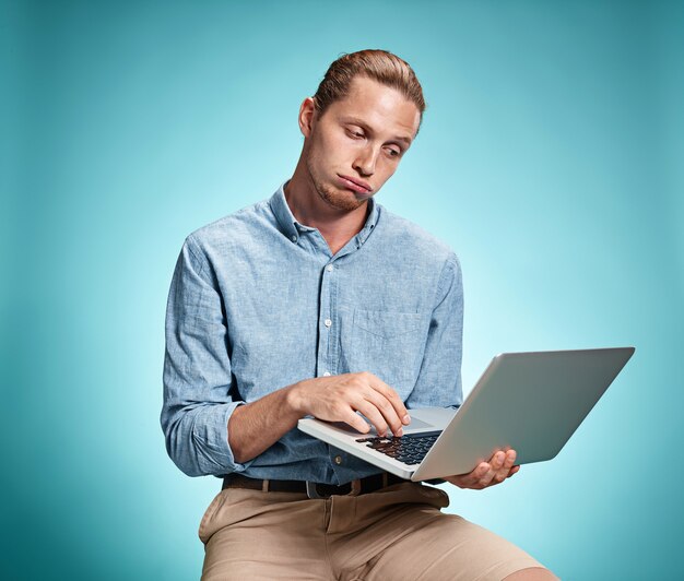 Young Man Working On Laptop