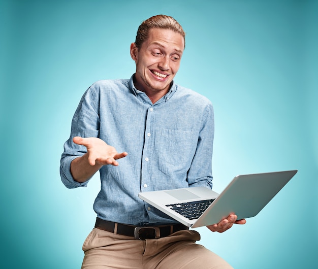 Young Man Working On Laptop