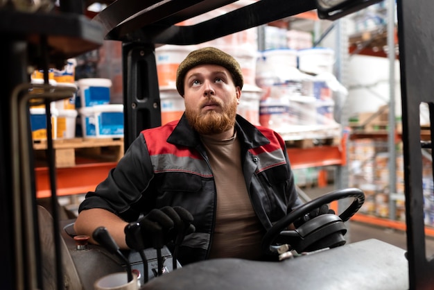 Free photo young man working in a warehouse