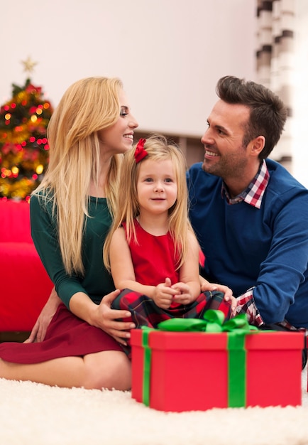 Young marriage with their daughter spending christmas together
