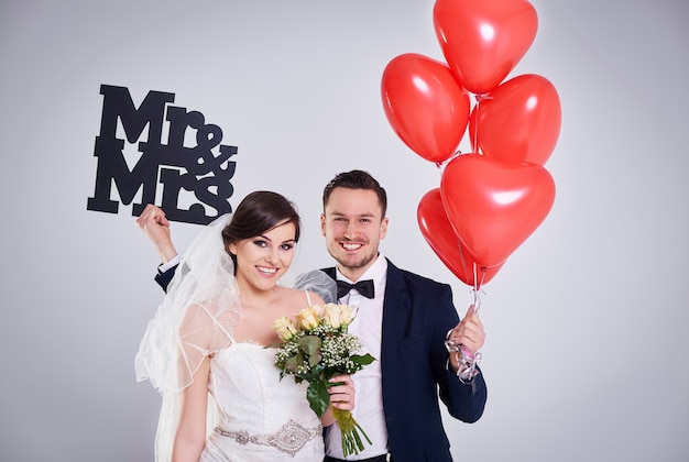 Young married couple posing in the studio