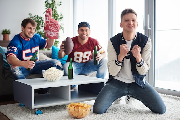 Young men watching American football competition