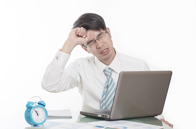 Young men working overtime in the office