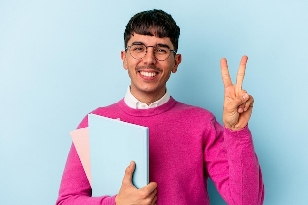 Young mixed race student man isolated on blue background showing number two with fingers.