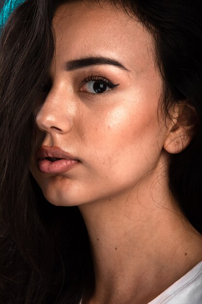 Young model in bronze summer makeup.