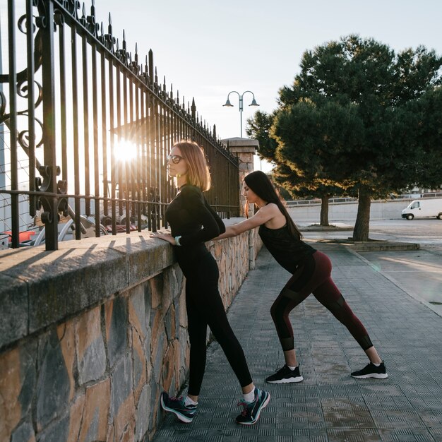 Young model in sportswear training outside