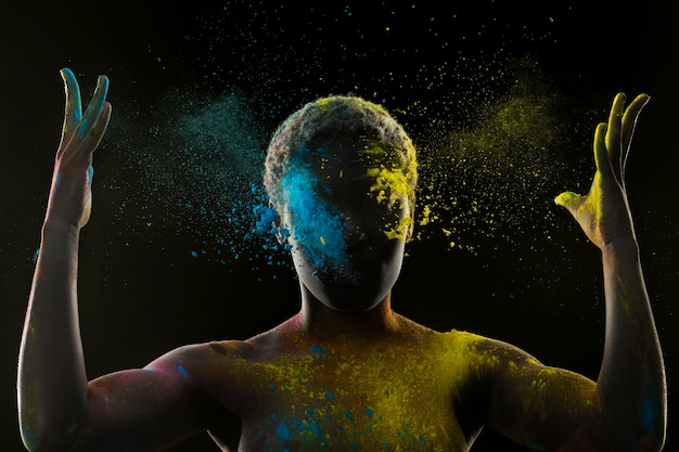 Young model with colorful powder medium shot