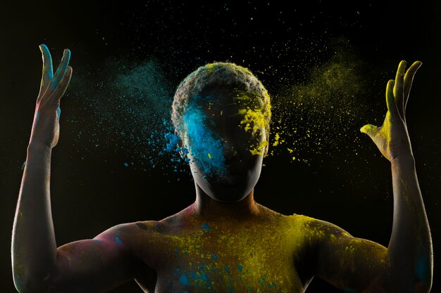 Young model with colorful powder medium shot
