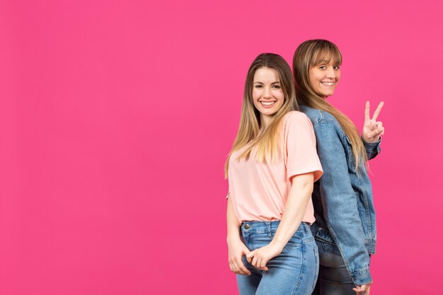 Young models posing with pink background