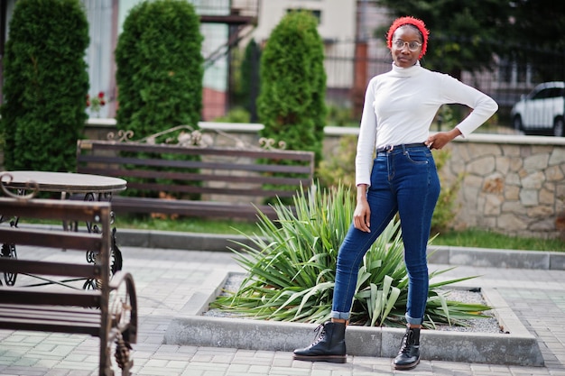 Young modern fashionable attractive tall and slim african muslim woman in hijab or turban head scarf posed