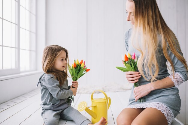 Young mother and daughter celebrating mothers day