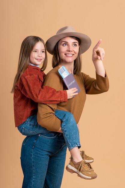 Young mother and daughter ready for traveling vacation