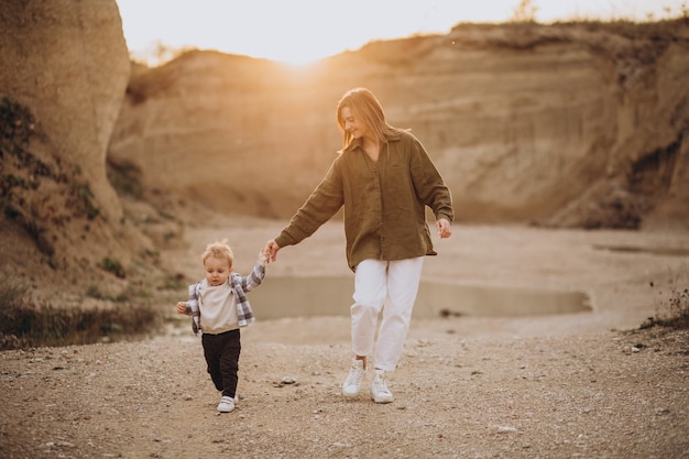 Young mother having fun with her little son