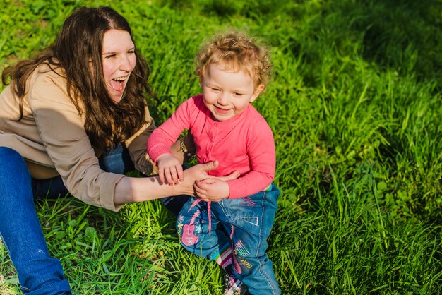 Young mother laughing with her son