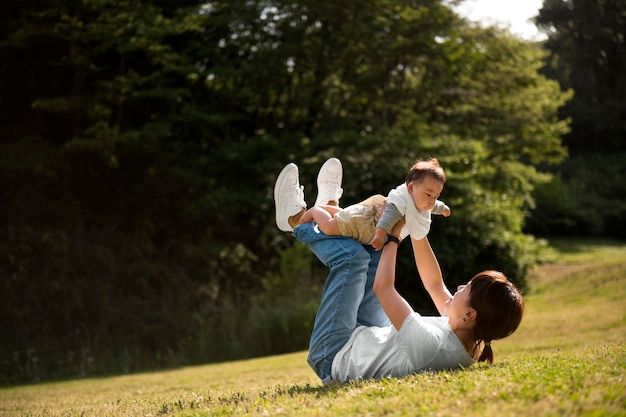 Free photo young mother spending time with her baby