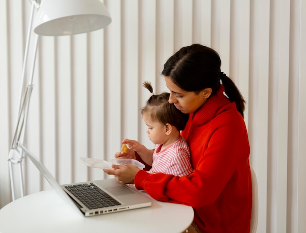 Free photo young mother spending time with her daughter