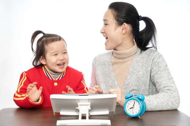 Young mother teaches daughter to paint