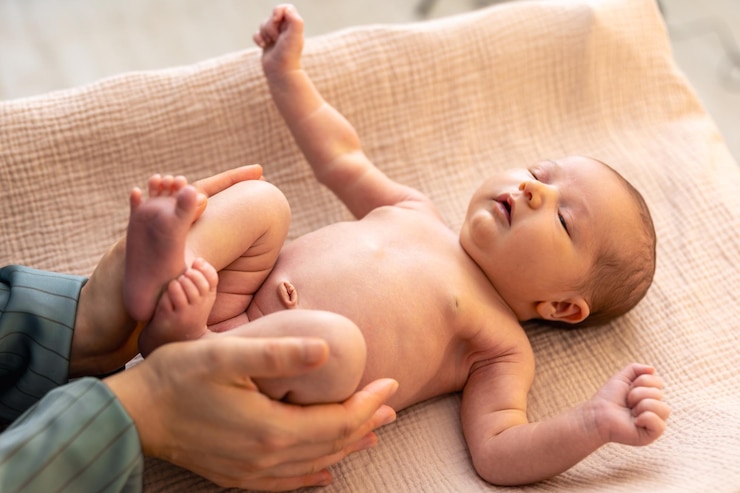 Free Photo a young mother with a newborn baby newborn baby