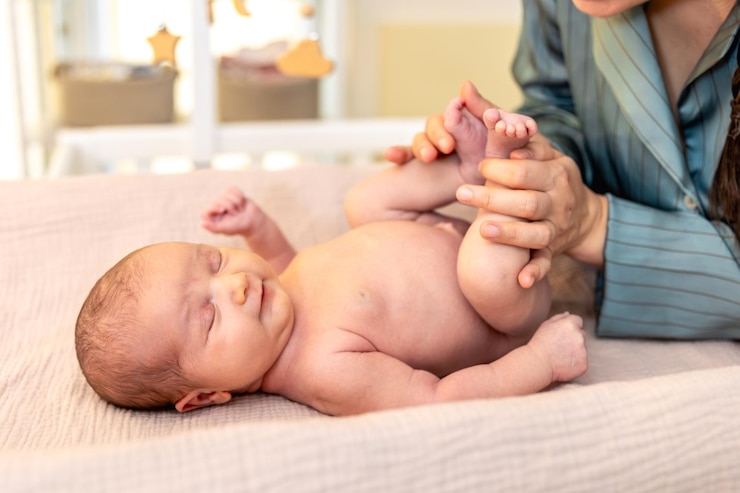 Free Photo a young mother with a newborn baby newborn baby