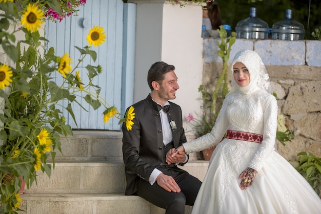 Free photo young muslim bride and groom wedding photos