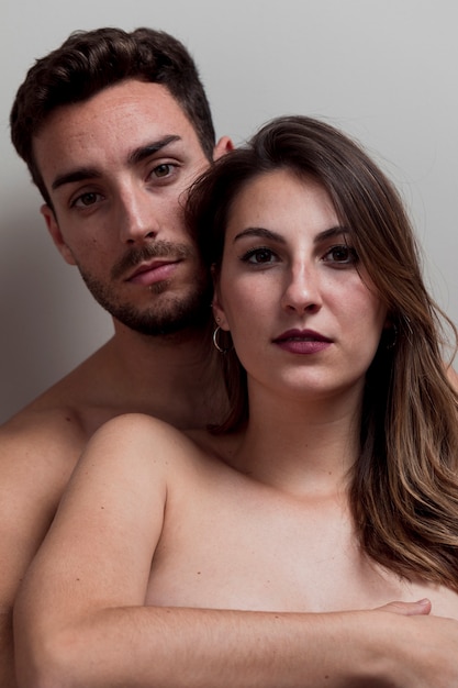 Free photo young naked couple embracing